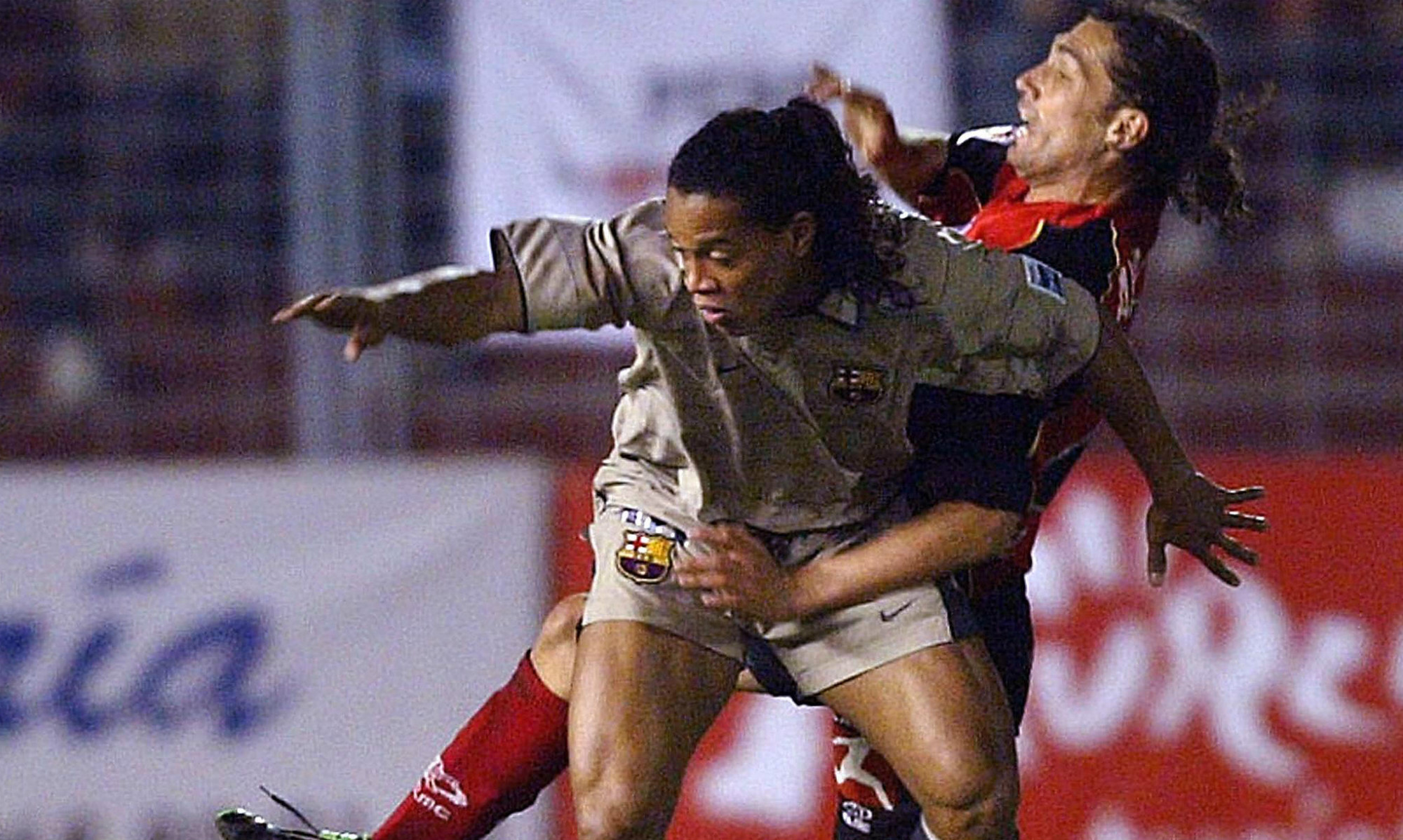 Brazilian maestro Ronaldinho skips away from a challenge on the day Oriol Riera made his FC Barcelona debut in the Copa Del Rey