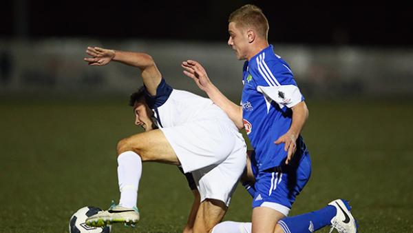 Riley Dillon and Deklan Gilmartin get themselves in a tangle during their Westfield FFA Cup match.