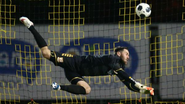 Goalkeeper Justin Pasfield makes a save for Sydney United 58 against Heidelberg United.