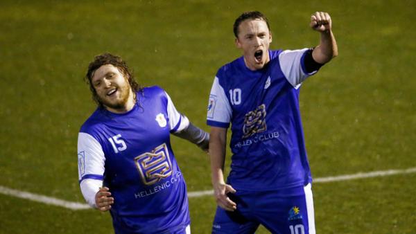 Robbie Cattanach celebrates the match-sealing second goal for Canberra Olympic over Redlands United in the FFA Cup.