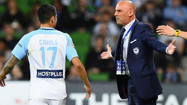 Kevin Muscat watches on during his side's 2-0 loss to Melbourne City.