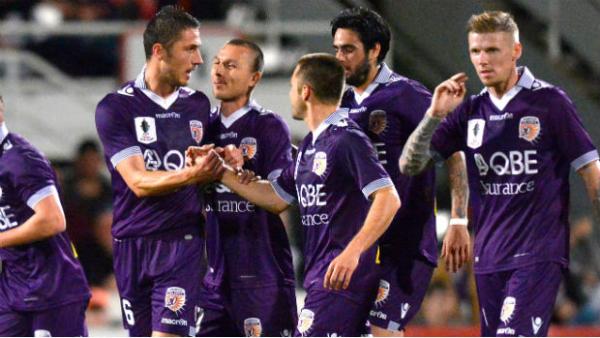 Perth Glory players celebrate one of Dino Djulbic two goals against Brisbane Roar in the Westfield FFA Cup.