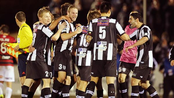 Adelaide City celebrate their decisive goal against Western Sydney.