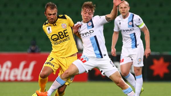 Glory goalscorer Gyorgy Sandor fights for the ball with City midfielder Jacob Melling.