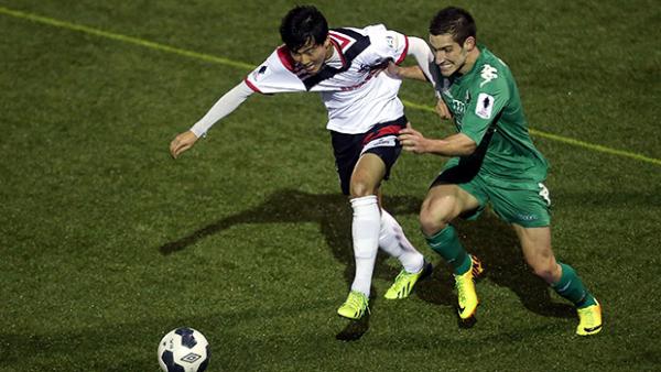 Danny Choi of Blacktown City and Jamie Deabreu of Bentleigh Greens compete for the ball.