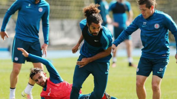 Melbourne City players take part in a training drill.